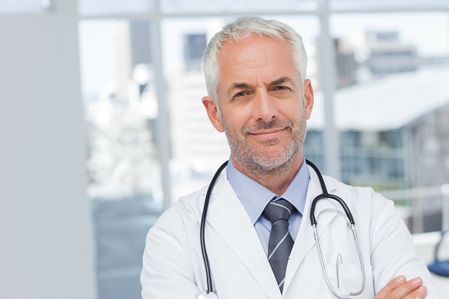 50s, Mature Adult, Man, Male, Caucasian, Indoors, Looking At Camera, Doctor, Practitioner, Profession, Professional, Specialist, Lab Coat, Stethoscope, Confident, Happy, Smile, Smiling, Standing, Clinic, Healthcare, Hospital, Medical, Staff, Attractive, Handsome, Grey Hair, Portrait, Arms Crossed